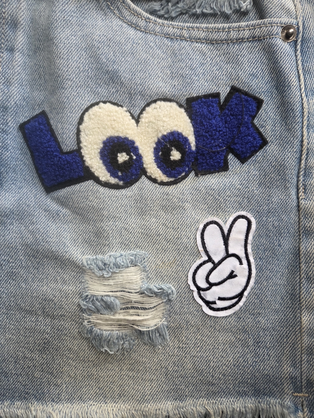 Hidden Jeans Light Wash Distressed Denim Mini Skirt with Fun Patches - Picture 6 of 11